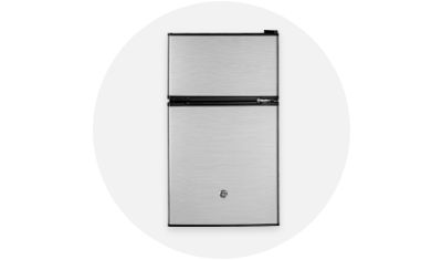 GE Appliances Compact Refrigerator product isolated on top of a light grey circle