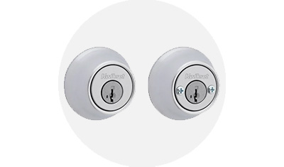 Kwikset 665 Collection Residential Deadbolt product isolated on top of a gray circle