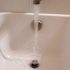 DANCO 2-in-1 Bathtub Hair Catcher and Stopper
