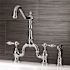 Kingston Brass Tudor 2-Handle Bridge Kitchen Faucet with Side Sprayer in Polished Chrome