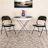 Black Hercules Series Double Braced Metal Folding Chairs with Footrests, Lightweight Steel Event Chairs (Set of 4)