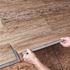 TrafficMaster Khaki Oak 4 MIL x 6 in. W x 36 in. L Grip Strip Water Resistant Luxury Vinyl Plank Flooring (24 sqft/case)