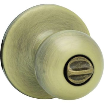 Image for Kwikset Polo Bed/bath Door Knob (Antique Brass) from HD Supply